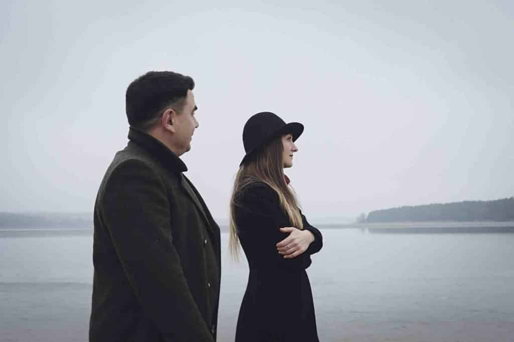 Young couple walking on the shore